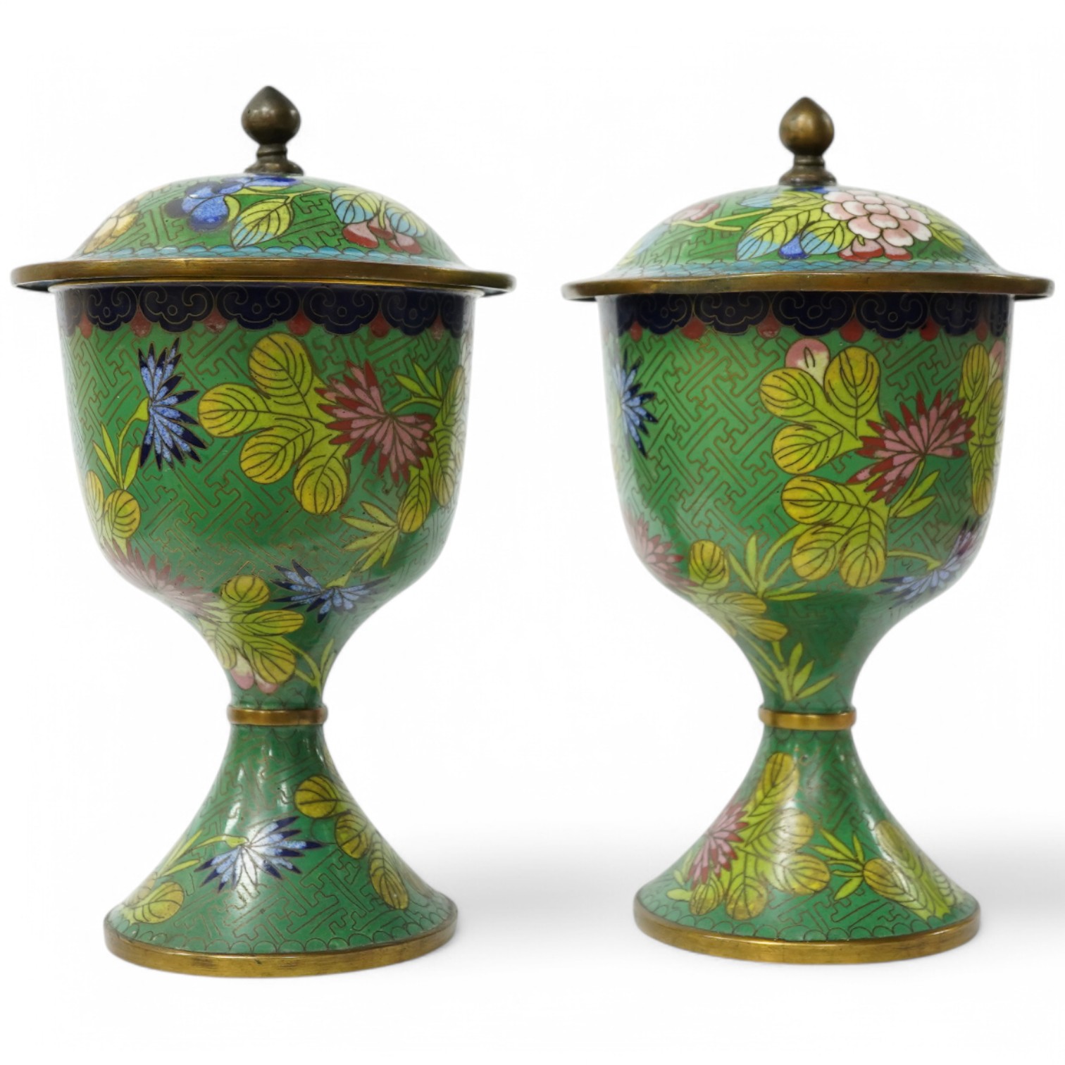 A pair of Chinese champleve enamel floral jars and covers, 22cm high. Condition - good